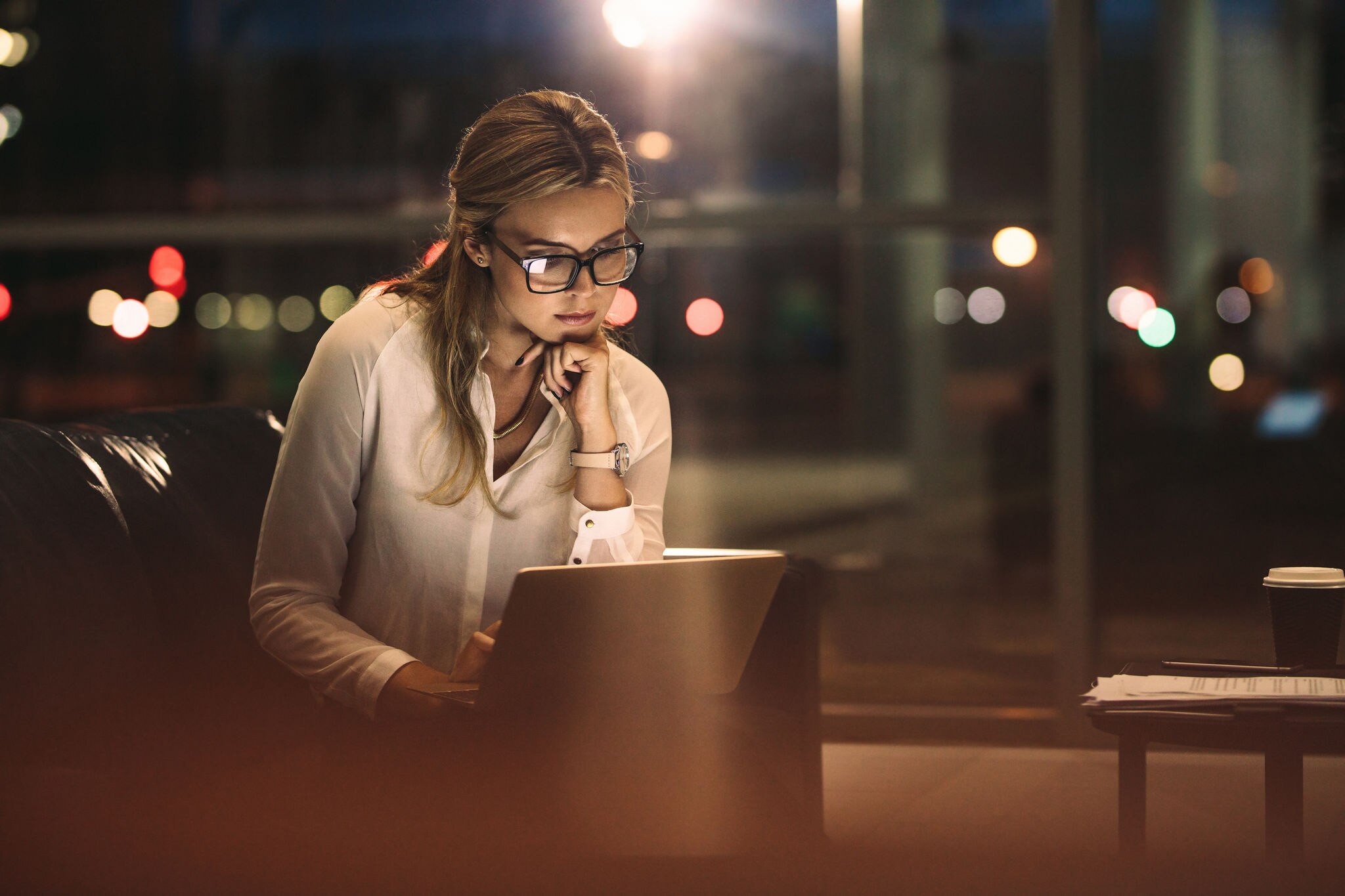 Business woman working late on laptop